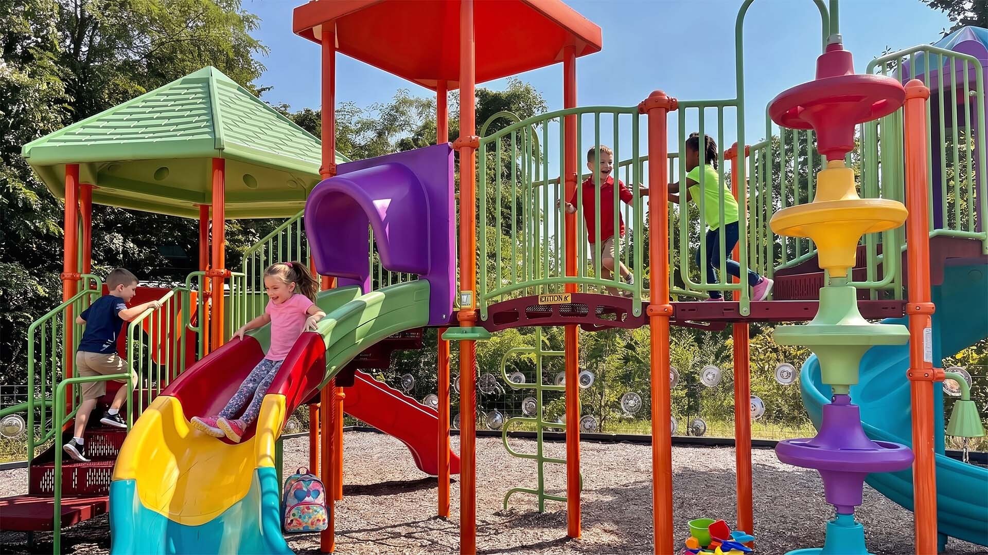 Children playing on the colorful playground at Uranus in St. Robert, Missouri