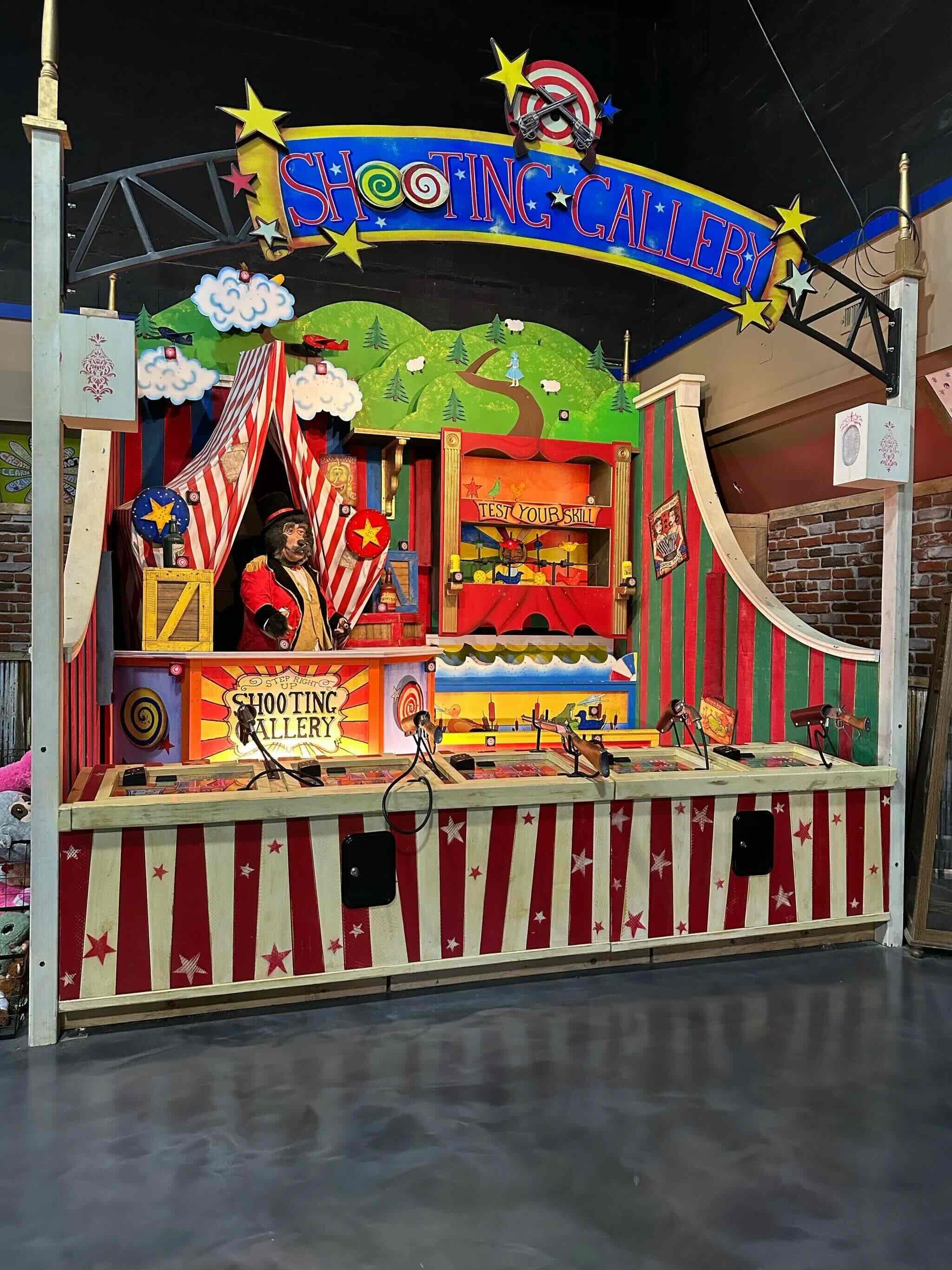 Carnival-style shooting gallery attraction inside Uranus in Richmond, Indiana