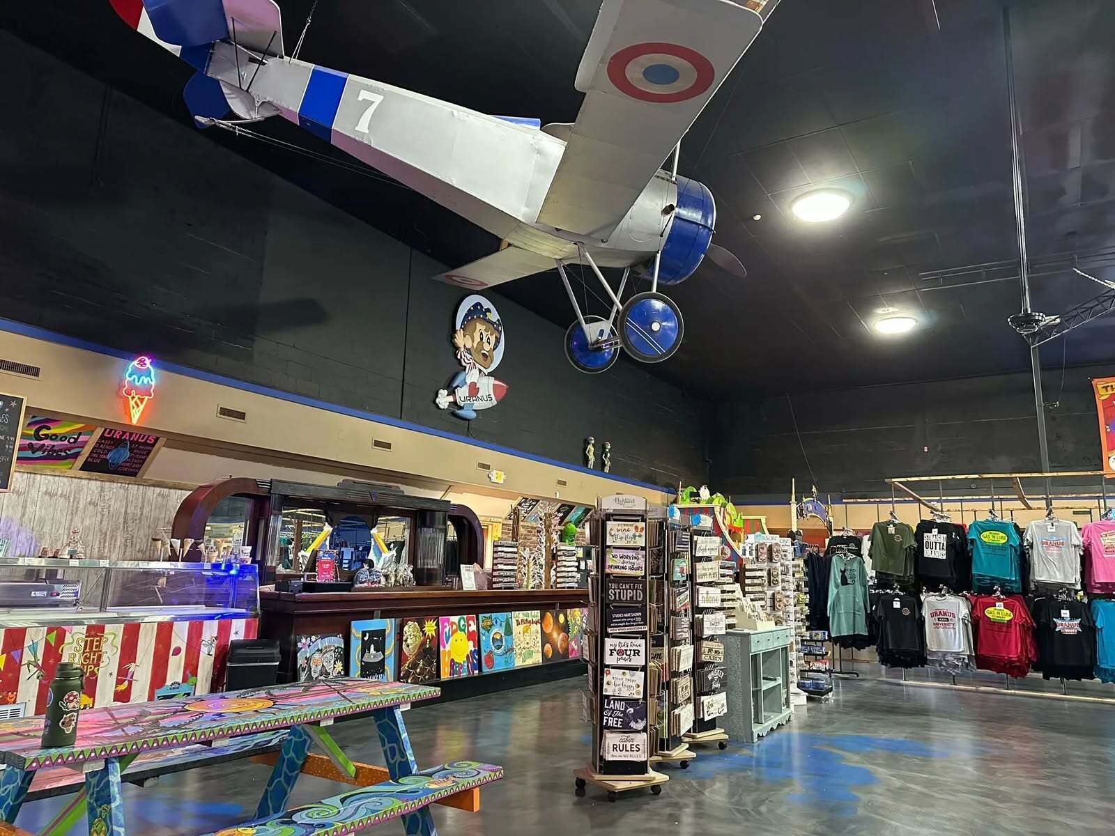 Vintage bi-plane suspended from the ceiling inside the Uranus General Store in Richmond, Indiana